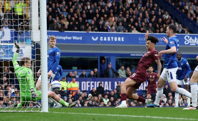 Soccer Football - Premier League - Everton v Manchester City - Goodison Park, Liverpool, Britain - April 19, 2025 Manchester City's Nico O'Reilly scores their first goal past Everton's Jordan Pickford REUTERS/Phil Noble EDITORIAL USE ONLY. NO USE WITH UNAUTHORIZED AUDIO, VIDEO, DATA, FIXTURE LISTS, CLUB/LEAGUE LOGOS OR 'LIVE' SERVICES. ONLINE IN-MATCH USE LIMITED TO 120 IMAGES, NO VIDEO EMULATION. NO USE IN BETTING, GAMES OR SINGLE CLUB/LEAGUE/PLAYER PUBLICATIONS. PLEASE CONTACT YOUR ACCOUNT REPRESENTATIVE FOR FURTHER DETAILS..