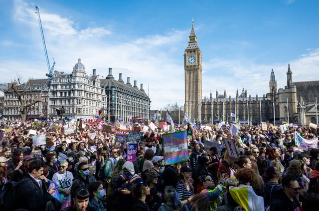 Members of the public gather in Parliament Square with banners and placards as part of the Trans Liberation emergency Protest on April 19, 2025 in London, England.