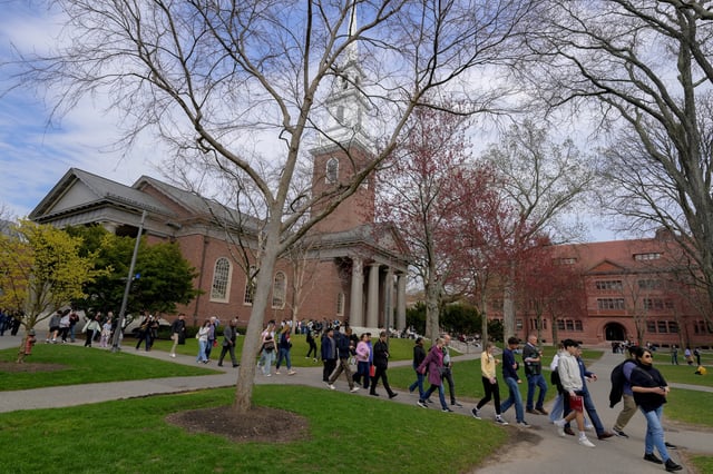 Students walk on the campus of Harvard University in Cambridge, Massachusetts, U.S., April 15, 2025.   REUTERS/Faith Ninivaggi/File Photo