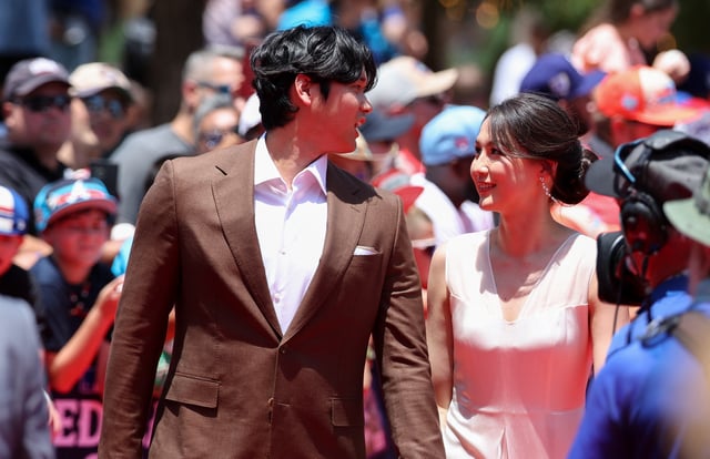 Jul 16, 2024; Arlington, Texas, USA; Los Angeles Dodgers pitcher Shohei Ohtani walks the red carpet with wife Mamiko Tanaka before the 2024 MLB All-Star game at Globe Life Field. Mandatory Credit: Kevin Jairaj-USA TODAY Sports/File Photo