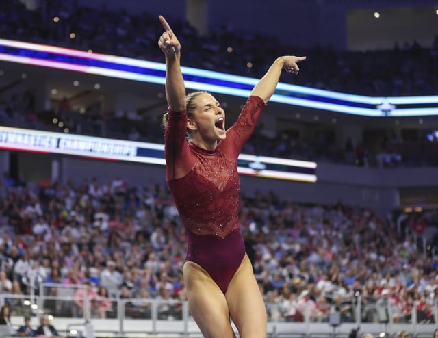 Oklahoma's Jordan Bowers celebrates after completing her floor routine during the finals of the NCAA Women's Gymnastics Championships. 