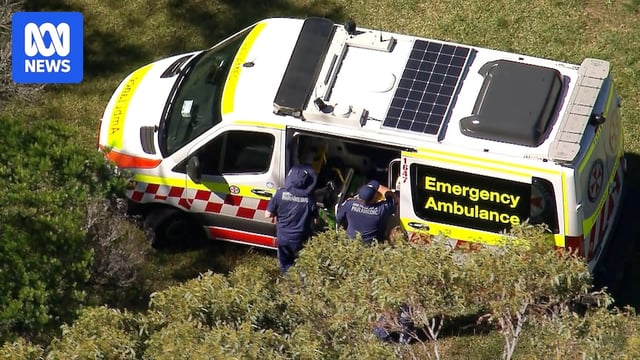 an aerial shot if ns ambulance with their doors open at Wattamolla after another rock fisherman died