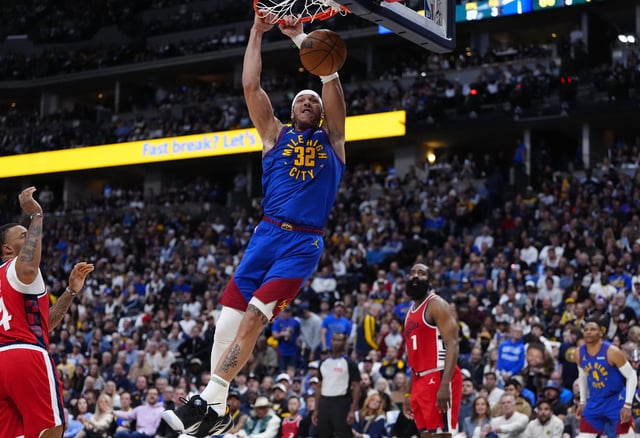 Apr 19, 2025; Denver, Colorado, USA; Denver Nuggets forward Aaron Gordon (32) finishes off a dunk in the second half against the LA Clippers at Ball Arena. Mandatory Credit: Ron Chenoy-Imagn Images