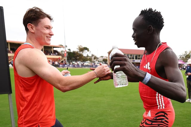 Lachlan Kennedy and Gout Gout embrace following heats for the Stawell Gift.