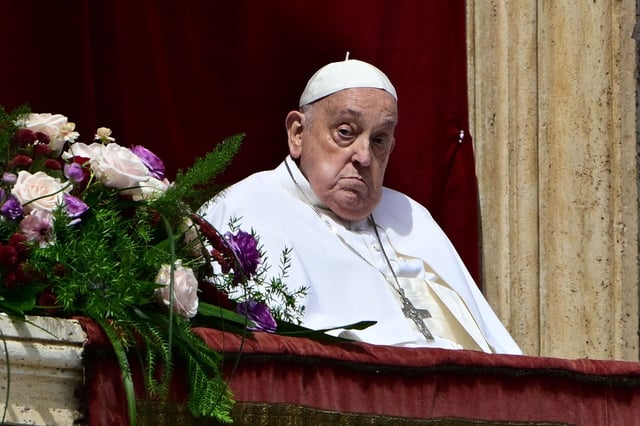 Pope Francis stands on the main balcony of St. Peter's basilica for the Urbi et Orbi message and blessing to the city and the world as part of Easter celebrations, at St Peter's square in the Vatican on April 20, 2025. (Photo by Tiziana FABI / AFP) (Photo by TIZIANA FABI/AFP via Getty Images)          