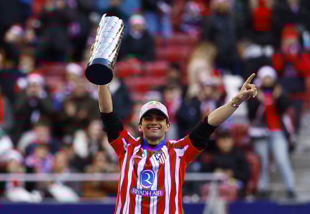 Soccer Football - LaLiga - Atletico Madrid v Getafe - Metropolitano, Madrid, Spain - December 15, 2024 MotoGP world champion Jorge Martin holds his trophy before the match REUTERS/Susana Vera