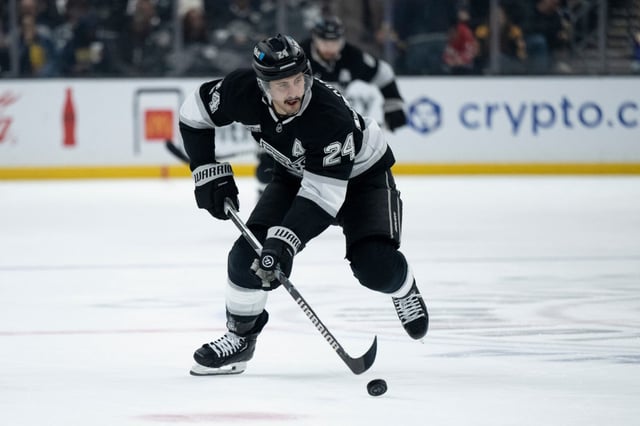 Kings center Phillip Danault controls the puck during a game against the Winnipeg Jets, Tuesday, April 1, 2025, in Los Angeles. (AP Photo/Kyusung Gong)