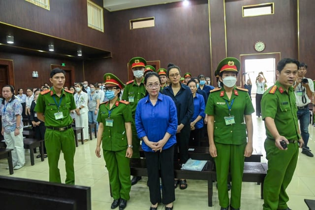 Vietnamese property tycoon Truong My Lan (C) -- jailed for life for money laundering -- will learn if her appeal has been successful