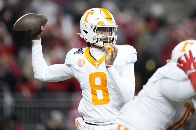 Dec 21, 2024; Columbus, Ohio, USA; Tennessee Volunteers quarterback Nico Iamaleava (8) throws against the Ohio State Buckeyes during the second half of the College Football Playoff first round game at Ohio Stadium. Ohio State won 42-17. Mandatory Credit: Adam Cairns-Imagn Images/File Photo