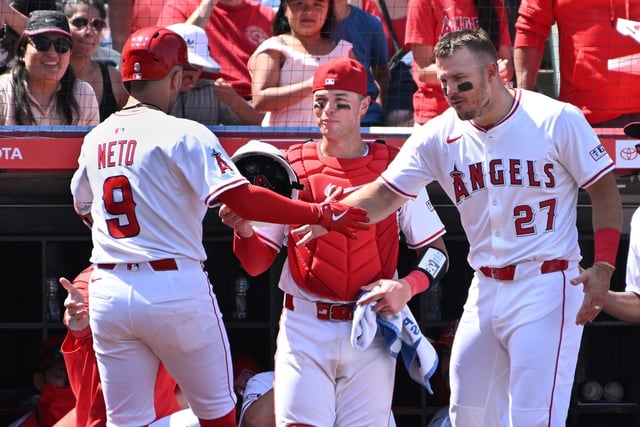 Angels shortstop Zach Neto (9) celebrates his solo home run against the San Francisco Giants with Los Angeles Angels outfielder Mike Trout (27) and Los Angeles Angels catcher Logan O’Hoppe during the fifth inning of a baseball game Sunday, April 20, 2025, in Anaheim, Calif. (AP Photo/Wally Skalij)
