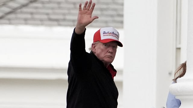 U.S. President Donald Trump gestures while wearing a hat that reads Gulf of America