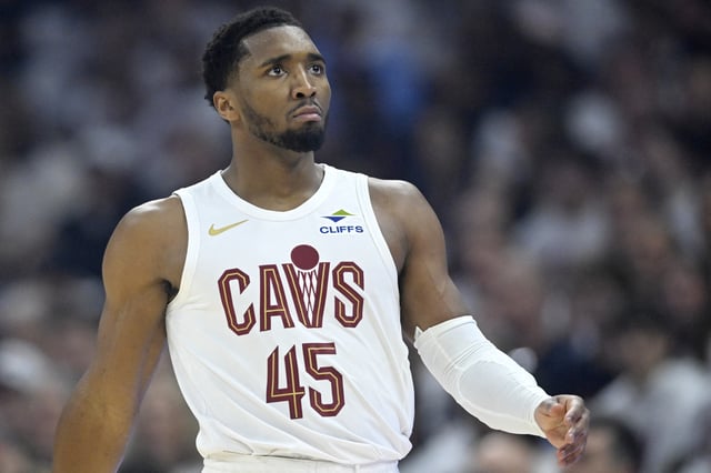 Apr 20, 2025; Cleveland, Ohio, USA; Cleveland Cavaliers guard Donovan Mitchell (45) walks on the court in the first quarter against the Miami Heat at Rocket Arena. Mandatory Credit: David Richard-Imagn Images
