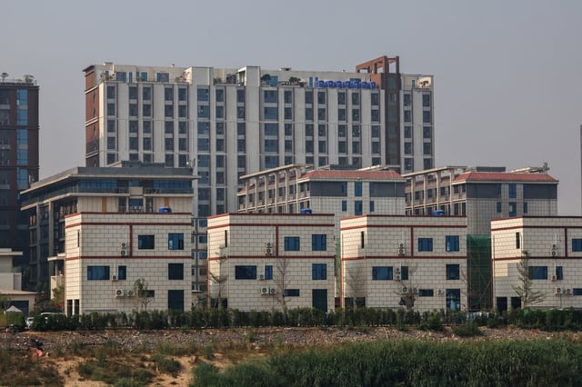 A general view of Shwe Kokko city, a casino, entertainment, and tourism complex, from Thailand's side of the border, after Thailand said it would suspend electricity supply to some border areas with Myanmar in an effort to curb scam centers, amid growing pressure on the illegal compounds that have ensnared vast numbers of people of multiple nationalities, in Mae Sot district, Thailand, February 5, 2025. REUTERS/Athit Perawongmetha/File Photo