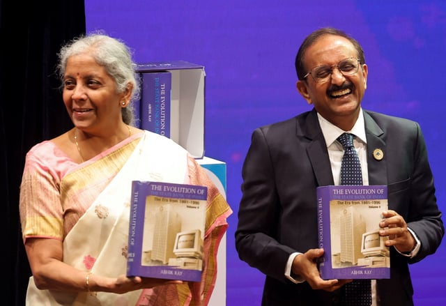 Challa Sreenivasulu Setty, Chairperson of the State Bank of India and India's Finance Minister Nirmala Sitharaman attend an event in Mumbai, India, November 18, 2024. REUTERS/Francis Mascarenhas