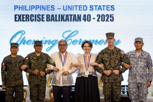 Philippine Balikatan Exercise Director Major General Francisco Lorenzo, Chief of Staff of the Armed Forces of the Philippines (AFP) Romeo Brawner Jr, Philippine Secretary of Foreign Affairs Enrique Manalo, U.S. Ambassador to the Philippines Marykay Carlson, U.S. Balikatan Exercise Director Lieutenant General James Glynn, and AFP Deputy Chief of Staff for Education, Training and Doctrine Major General Llewillyn S Banaag pose for a picture during the opening ceremony of the annual Philippines-U.S. joint military exercises or Balikatan, at the Armed Forces of the Philippines headquarters, in Quezon City, Metro Manila, Philippines, April 21, 2025. REUTERS/Eloisa Lopez