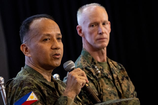 Philippine Balikatan Exercise Director Major General Francisco Lorenzo answers questions from the media beside his counterpart U.S. Balikatan Exercise Director Lieutenant General James Glynn after the opening ceremony of the annual Philippines-U.S. joint military exercises or Balikatan, at the Armed Forces of the Philippines headquarters, in Quezon City, Metro Manila, Philippines, April 21, 2025. REUTERS/Eloisa Lopez