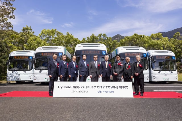 This photo provided by Hyundai Motor Co. on April 21, 2025, shows executives of the South Korean automaker and Japan's Iwasaki Group at an electric bus delivery ceremony held in Yakushima, Kagoshima Prefecture. (PHOTO NOT FOR SALE) (Yonhap)
