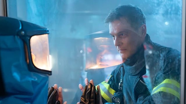 Bobby talks to Athena through glass