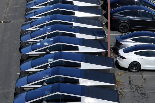 New Cybertrucks sit at a Tesla dealership on April 2, 2025, in Corte Madera, California.