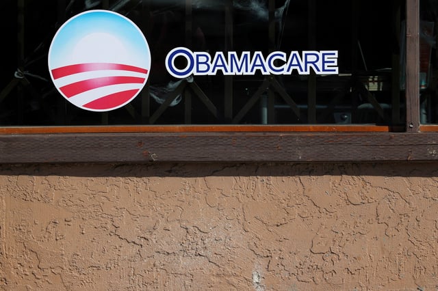 A sign on an insurance store advertises Obamacare in San Ysidro, San Diego, California, U.S., October 26, 2017. REUTERS/Mike Blake/File Photo