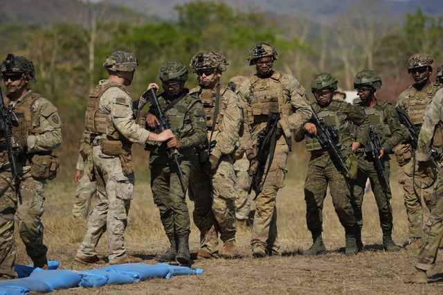 FILE - Filipino and U.S. soldiers participate during a joint military drill called Salaknib at Fort Magsaysay, Nueva Ecija province, northern Philippines on March 31, 2023. (AP Photo/Aaron Favila, File)
