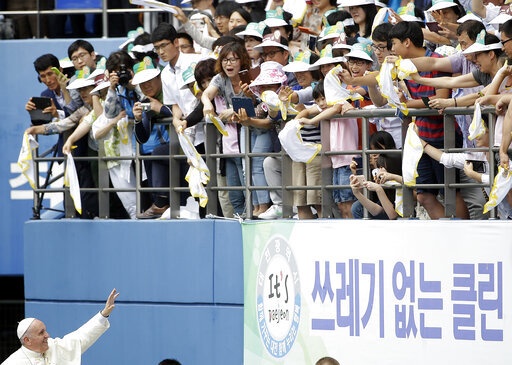 FILE - Pope Francis blesses faithfuls as he arrives to celebrate the Mass of Assumption of Mary at Daejeon World Cup stadium in Daejeon, South Korea, Friday, Aug. 15, 2014. (AP Photo/Gregorio Borgia, file)