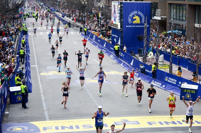 Former Boston Bruins NHL player Zdeno Chara (center #3333) looks on before he crosses the finish line of the 128th Boston Marathon on April 15, 2024 in Boston, Massachusetts.