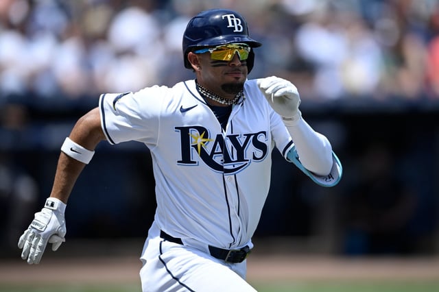 Tampa Bay Rays&#39; Christopher Morel sprints to first base for a single as New York Yankees first baseman Paul Goldschmidt, not pictured, is pulled off of the bag by a wide throw during the first inning of a baseball game, Sunday, April 20, 2025, in Tampa, Fla. (AP Photo/Phelan M. Ebenhack)
