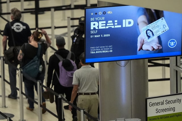 Travelers move through Hartsfield-Jackson Atlanta International Airport ahead of Memorial Day, Friday, May 24, 2024, in Atlanta.