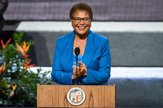 Karen Bass (L) speaks after being sworn in as the Mayor of Los Angeles by US Vice President Kamala Harris during her inauguration at LA Live in Los Angeles, California, on December 11, 2022. 
