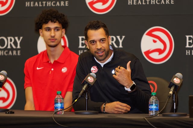 Jun 28, 2024; Atlanta, Georgia, USA; Atlanta Hawks general manager Landry Fields, right, talks to the media with first overall pick Zaccharie Risacher at the Emory Sports Medicine Complex. Mandatory Credit: Brett Davis-USA TODAY Sports/ File Photo