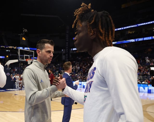 Florida coach Todd Golden (left) greets Gators’ guard Denzel Aberdeen prior to UF’s 95-90 win against the Aggies during the SEC Tournament semifinals March 16 at Bridgestone Arena in Nashville, Tenn. (UF’s University Athletic Association Communications/Maddie Washburn)