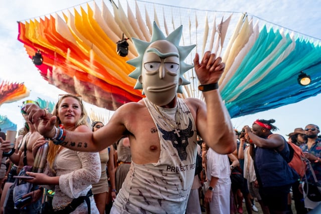A festivalgoer wearing a Rick mask dances during Bob Moses’ set at the Do LaB stage during the opening day of Weekend One of the Coachella Valley Music and Arts Festival in Indio on Friday, April 11, 2025. (Photo by Watchara Phomicinda, Contributing Photographer)