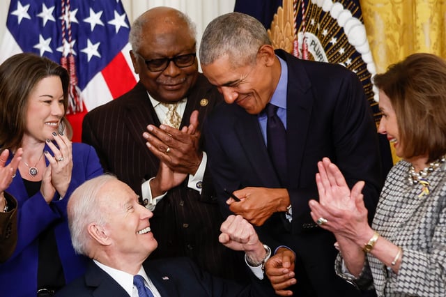 President Joe Biden fist bumps former President Barack Obama after Biden signed an executive order aimed at strengthening the Affordable Care Act during an event to mark the 2010 passage of the Affordable Care Act in the East Room of the White House on April 5, 2022 in Washington, DC. With then-Vice President Joe Biden by his side, Obama signed 'Obamacare' into law on March 23, 2010.