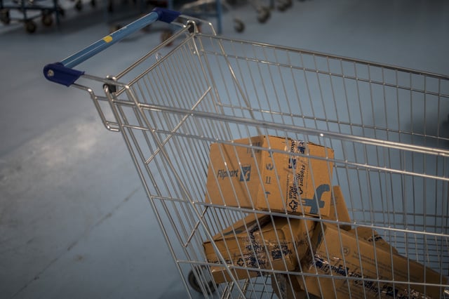 Packages in a cart at a Flipkart Internet Pvt. warehouse in Koduvalli, Thiruvallur, in the outskirts of Chennai, India, on Wednesday. Sept. 22, 2021. Walmart-backed e-commerce giant Flipkart added 115,000 jobs this Diwali holiday sales season, up from 70,000 in 2020 and 50,000 in 2019. hotographer: Anindito Mukherjee/Bloomberg via Getty Images