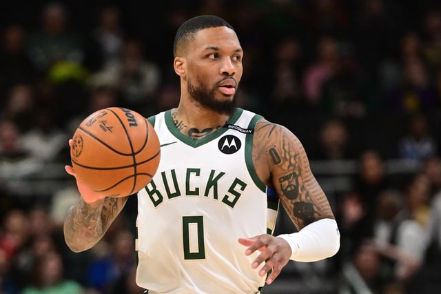 Mar 13, 2025; Milwaukee, Wisconsin, USA; Milwaukee Bucks guard Damian Lillard (0) dribbles the ball against the Los Angeles Lakers in the first quarter at Fiserv Forum. The Bucks wore a small patch to honor former player Junior Bridgeman who passed away this week.  Mandatory Credit: Benny Sieu-Imagn Images/File Photo