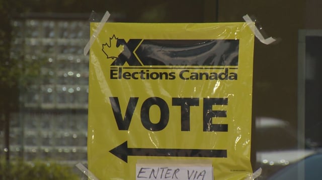 An Elections Canada sign directs voters to a Vancouver polling place. 
