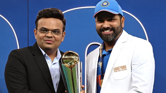 ICC chairman Jay Shah, left, presents the ODI Champions Trophy to India captain Rohit Sharma