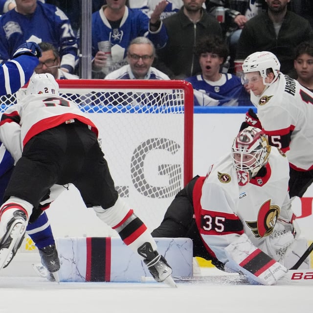 Toronto Maple Leafs' Matthew Knies (23) scores a goal on Ottawa Senators' goaltender Linus Ullmark (35) as Artem Zub (2) tries to defend during third period NHL playoff action in Toronto, on Sunday, April 20, 2025. THE CANADIAN PRESS/Frank Gunn