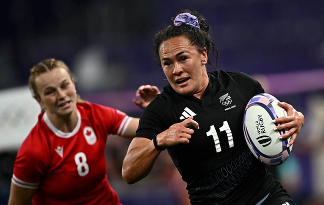 Paris 2024 Olympics - Rugby Sevens - Women's Pool A - New Zealand vs Canada - Stade de France, Saint-Denis, France - July 28, 2024. Portia Woodman-Wickliffe of New Zealand in action with Carissa Norsten of Canada REUTERS/Dylan Martinez/File Photo