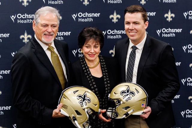 New Orleans Saints owner Gayle Benson and general manager Mickey Loomis pose with the new head coach Kellen Moore at Ochsner Sports Performance Center.