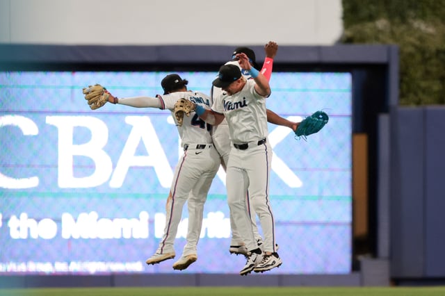 Apr 21, 2025; Miami, Florida, USA; Miami Marlins right fielder Kyle Stowers (28) celebrates with left fielder Javier Sanoja (46) and center fielder Jesus Sanchez (7) after the game against the Cincinnati Reds at loanDepot Park. Mandatory Credit: Sam Navarro-Imagn Images