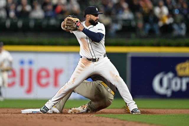 Apr 21, 2025; Detroit, Michigan, USA; Detroit Tigers second base Gleyber Torres (25) attempts to turn a double play at second base against the San Diego Padres in the sixth inning at Comerica Park. Mandatory Credit: Lon Horwedel-Imagn Images