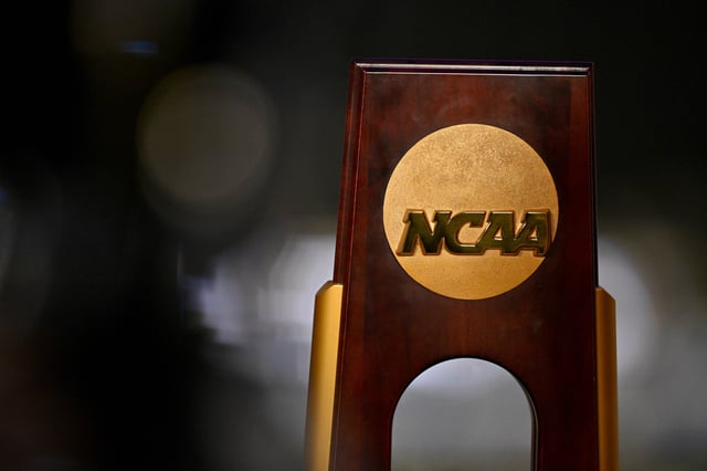 Apr 19, 2025; Fort Worth, TX, USA; A view of the NCAA logo and trophy before the 2025 Women's National Gymnastics Championship at Dickies Arena. Mandatory Credit: Jerome Miron-Imagn Images/File Photo