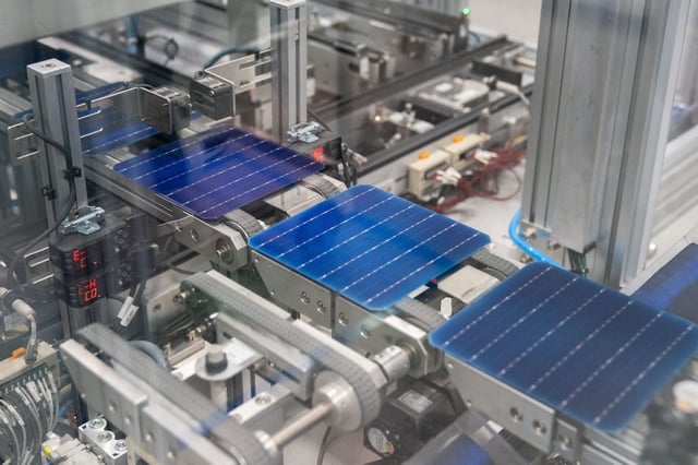 A machine etches solar cells at the Hanwha Q Cells solar cell and module manufacturing facility in Dalton, Georgia on Oct. 6, 2022.