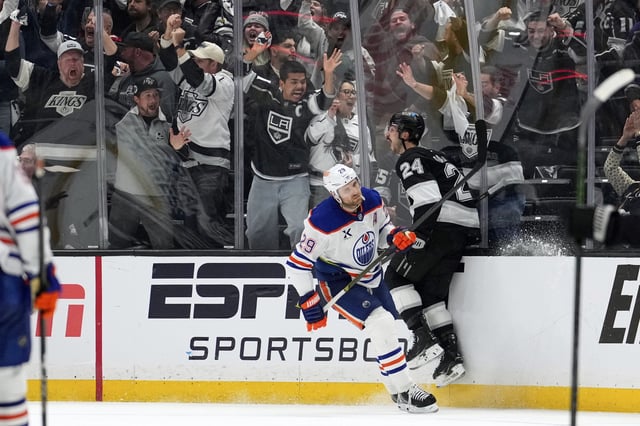 Los Angeles Kings center Phillip Danault, right, celebrates his goal as Edmonton Oilers center Leon Draisaitl skates away during the third period in Game 1 of an NHL hockey first-round playoff series Monday, April 21, 2025, in Los Angeles.