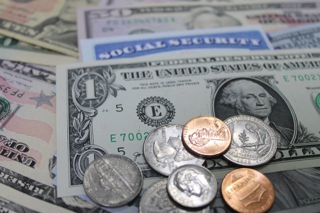 Stock image/file photo: A Social Security card with U.S. Dollars.