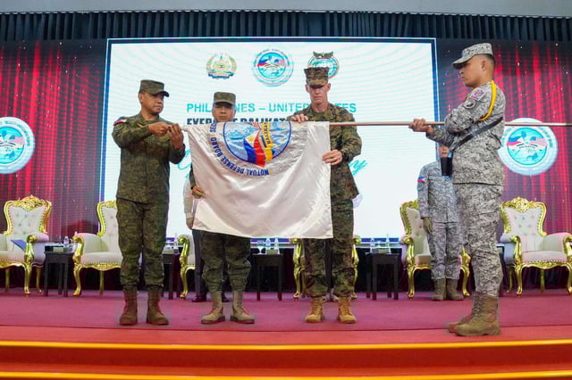AFP Chief of Staff General Romeo S Brawner Jr with LtGen James F Glynn, U.S. Exercise Director, and MGen Francisco F Lorenzo Jr., Philippine Exercise Director unfurl the Exercise Balikatan 40-2025 flag during its Opening Ceremony on April 21. (Photo by AFP Public Affair Office)