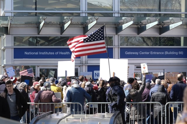 Demonstrators protest funding cuts outside of the National Institutes of Health (NIH) in Bethesda, Maryland, on March 8, 2025. (Photo by Michael Mathes / AFP) (Photo by MICHAEL MATHES/AFP via Getty Images)