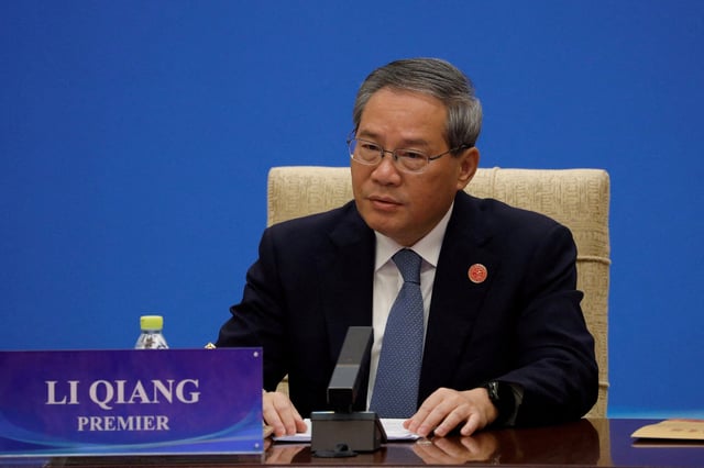 Chinese Premier Li Qiang attends a conference of the theme "Building Consensus on Development to Promote Global Common Prosperity", with other leaders from international economic organisations, in Beijing, China December 9, 2024. REUTERS/Shubing Wang/File Photo